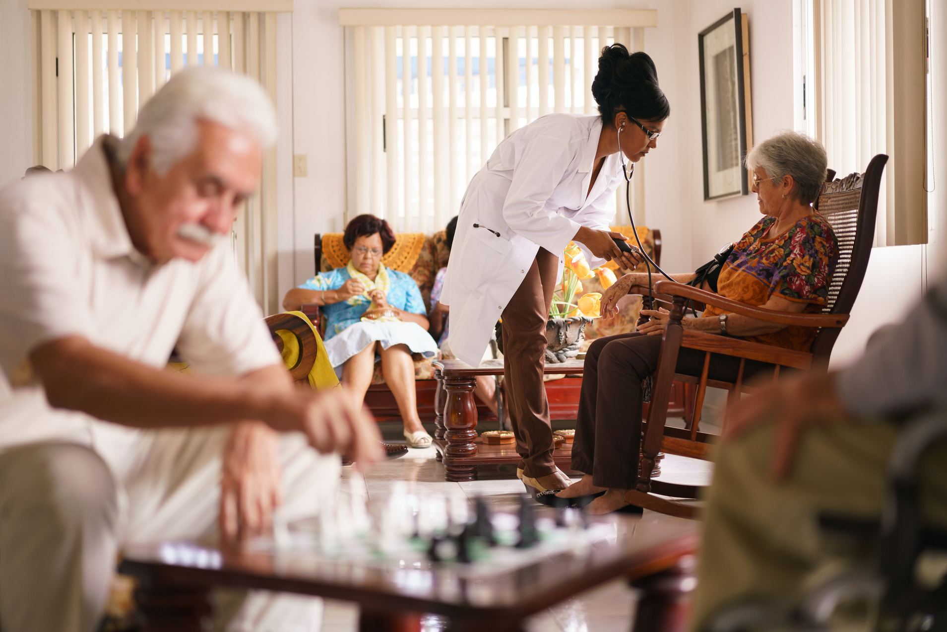 Hospice Doctor Measuring Blood Pressure 